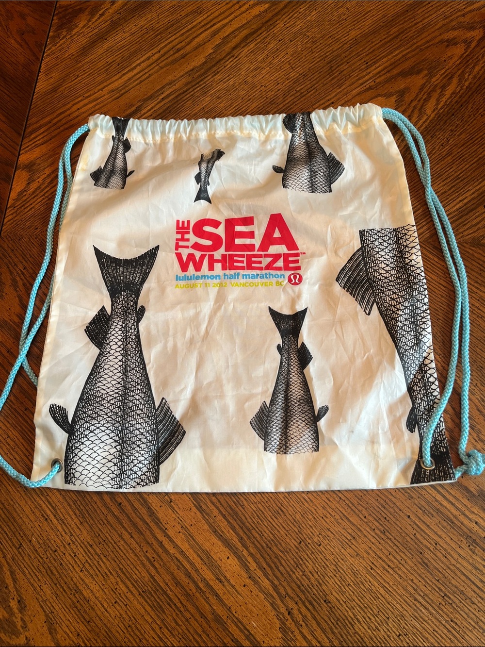 Seawheeze 2012  White Drawstring Bag with Black Fish Print and Blue Cords